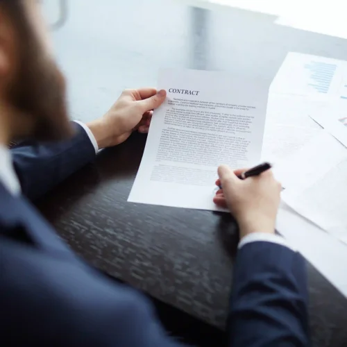 executive-reviewing-contract-with-new-company executive-reviewing-contract-with-new-company
